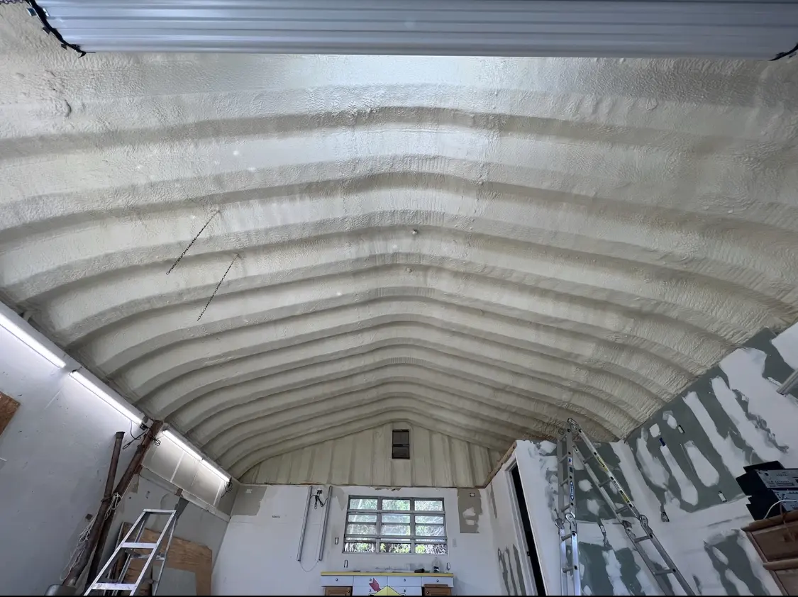 Spray polyurethane foam applied to the underside of a metal roof deck in Wisconsin Rapids